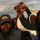 Demonstrators put their fists in the air as a sign of “black power” during a protest against police brutality and the death of Freddie Gray outside a police station in Baltimore on April 22, 2015. (Chip Somodevilla/Getty Images)